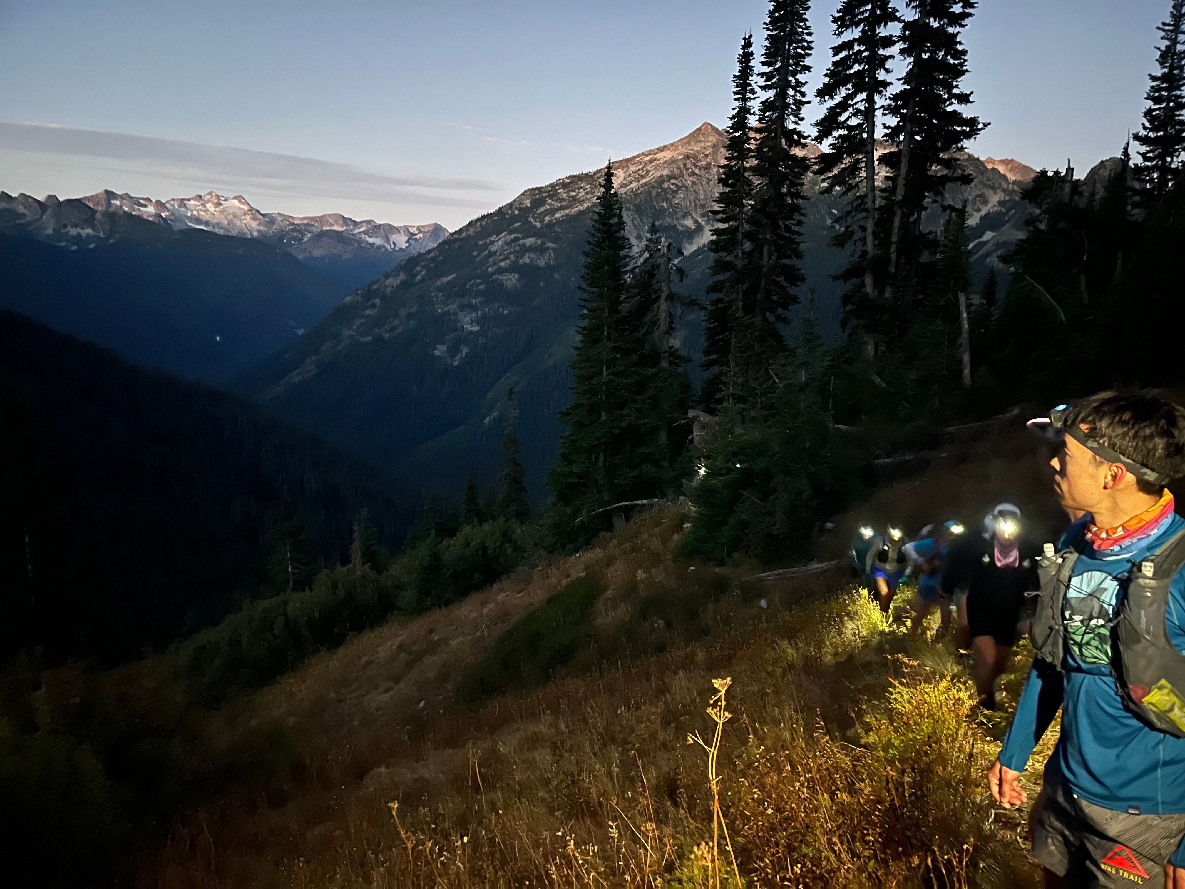 A group of trail runners at the trailhead before a Smooth Mooves group run.